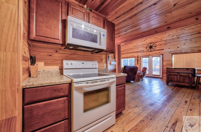 kitchen featuring wood walls, white appliances, light hardwood / wood-style floors, and wooden ceiling