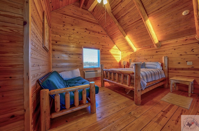 bedroom featuring light hardwood / wood-style flooring, lofted ceiling with beams, wooden ceiling, an AC wall unit, and wooden walls