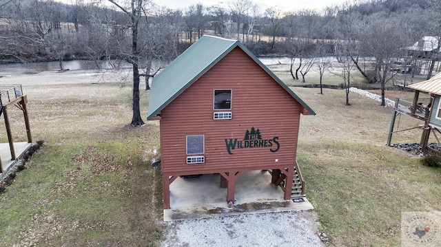 view of property exterior featuring a water view