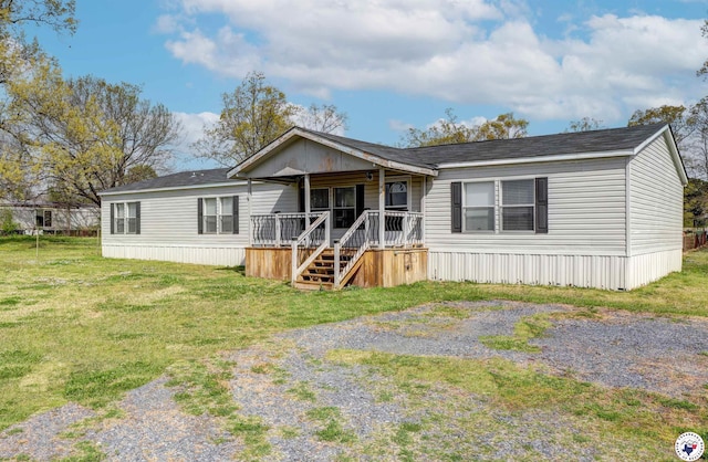 9960 W New Boston Rd, Hooks, TX 75561 - manufactured / mobile home featuring a porch and a front lawn