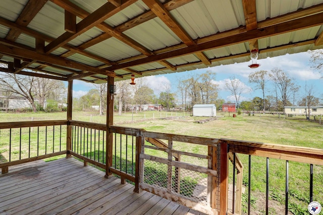 9960 W New Boston Rd, Hooks, TX 75561 - deck featuring a lawn, an outbuilding, and a shed