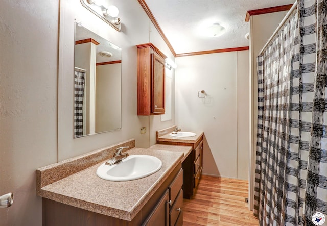 9960 W New Boston Rd, Hooks, TX 75561 - full bathroom with wood finished floors, ornamental molding, a sink, and two vanities