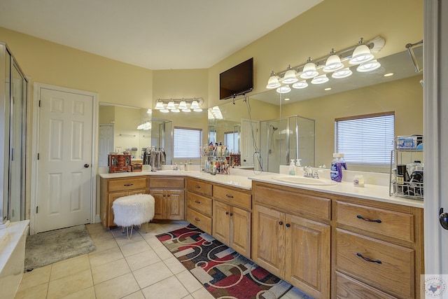 full bath with tile patterned floors, a shower stall, and vanity