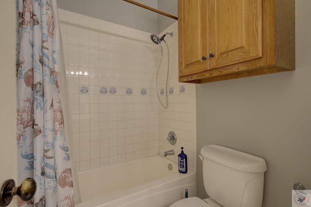 bathroom with toilet and shower / bath combo with shower curtain