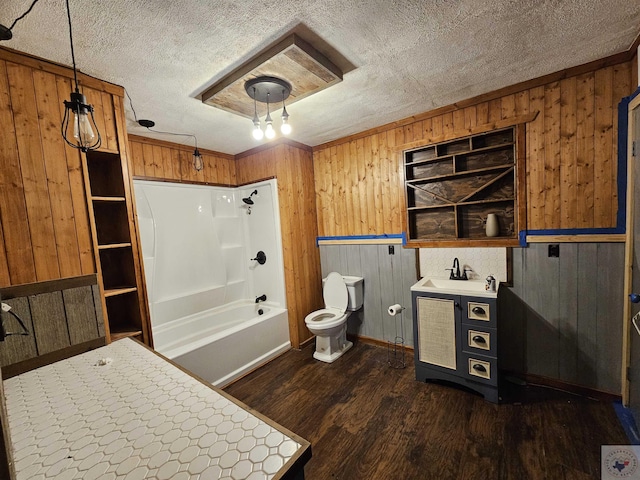 full bathroom with built in features, bathing tub / shower combination, hardwood / wood-style floors, toilet, and wooden walls