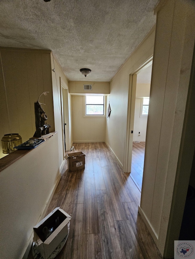 corridor featuring dark hardwood / wood-style flooring