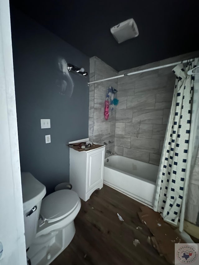 bathroom featuring shower / tub combo with curtain, wood-type flooring, and toilet