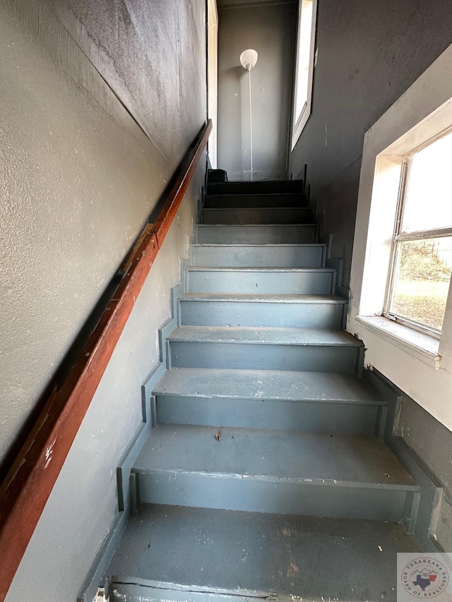 stairs with concrete floors