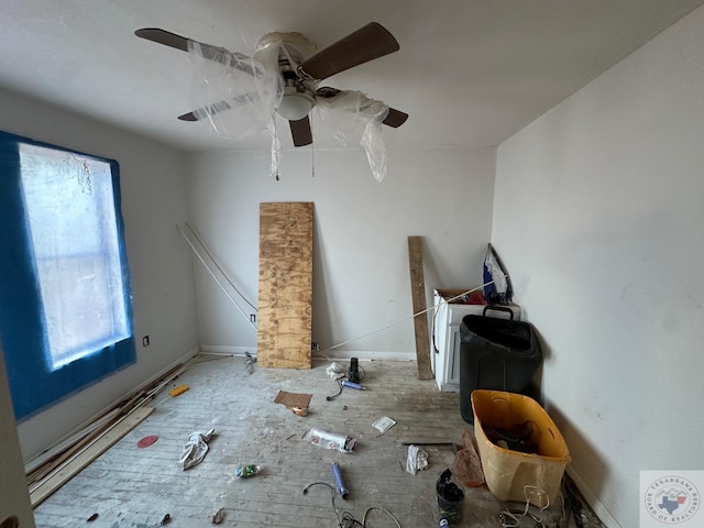 interior space featuring multiple windows and ceiling fan