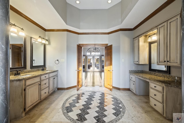 full bath with vanity, baseboards, and ornamental molding