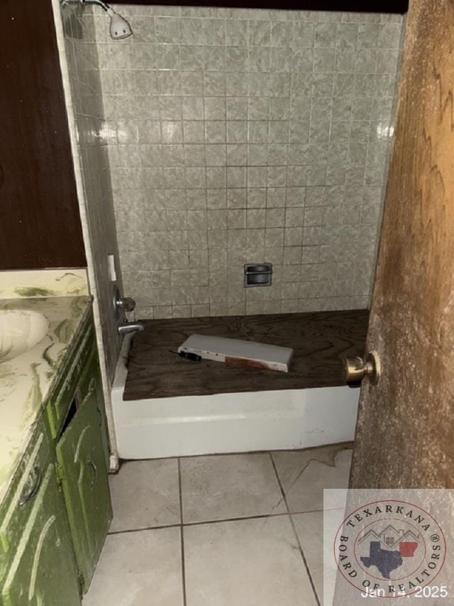 bathroom featuring walk in shower, tile patterned floors, and vanity