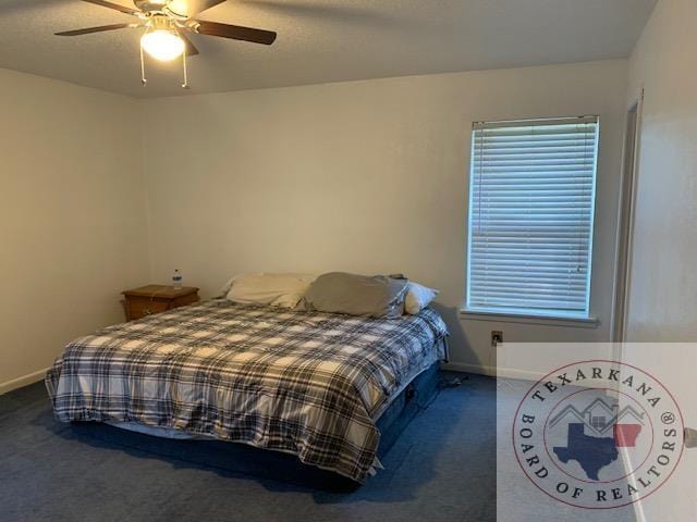 carpeted bedroom with ceiling fan