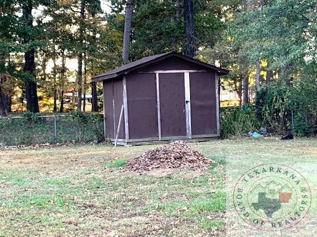 view of outdoor structure with a yard