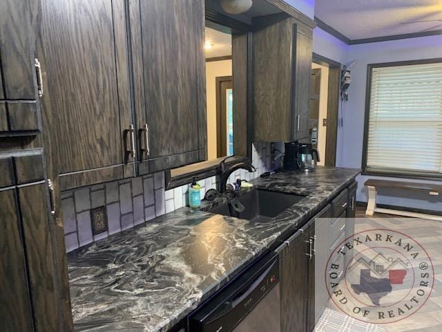 kitchen with dishwasher, dark brown cabinets, sink, ornamental molding, and dark stone counters