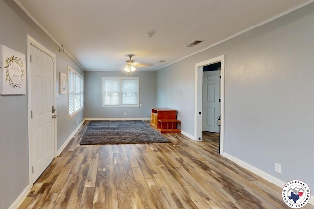 2101 N Fm 2148, Texarkana, TX 75501 - spare room featuring ornamental molding, wood finished floors, a ceiling fan, and baseboards