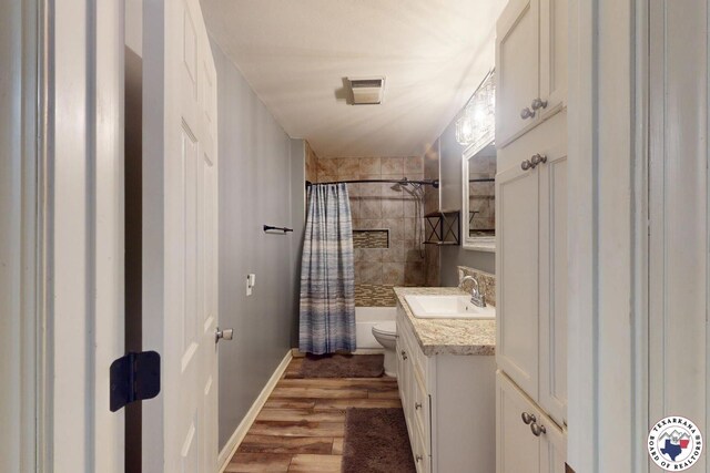 2101 N Fm 2148, Texarkana, TX 75501 - bathroom with vanity, toilet, wood finished floors, and baseboards