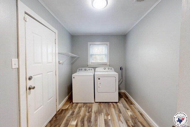 2101 N Fm 2148, Texarkana, TX 75501 - laundry area featuring washing machine and clothes dryer, light wood-type flooring, crown molding, and baseboards