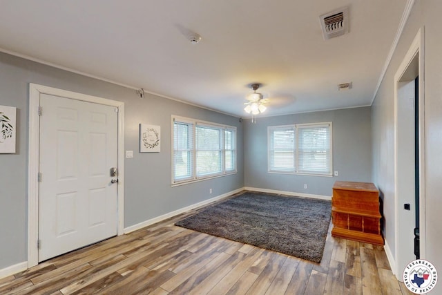 2101 N Fm 2148, Texarkana, TX 75501 - entryway with ornamental molding, wood finished floors, ceiling fan, and baseboards