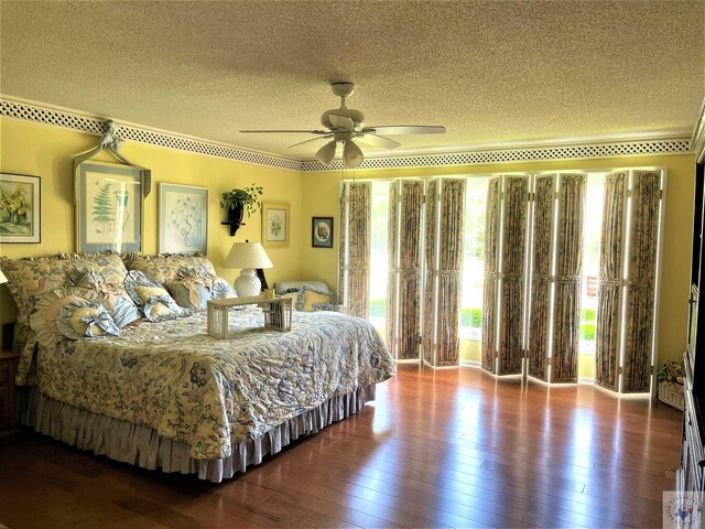 501 Park St, Atlanta, TX 75551 - bedroom with a textured ceiling, ceiling fan, and hardwood / wood-style flooring
