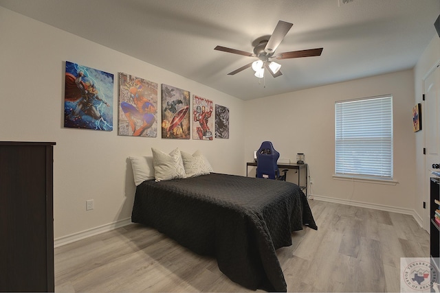 bedroom featuring light wood-type flooring and ceiling fan