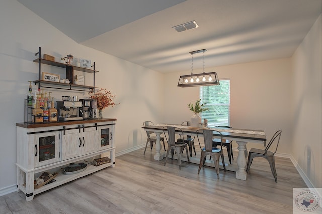 dining area with light wood-type flooring