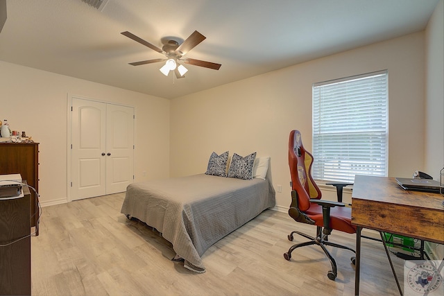 bedroom featuring a closet, ceiling fan, and light hardwood / wood-style floors