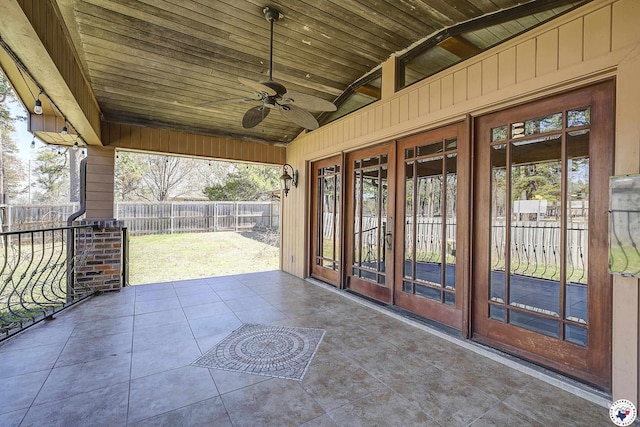 view of patio featuring a fenced backyard, ceiling fan, and french doors