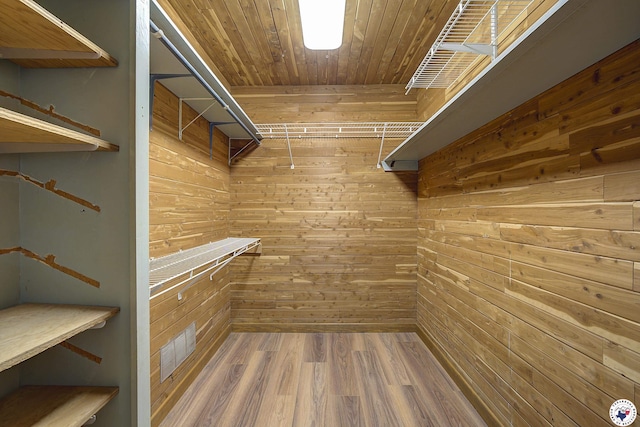 spacious closet with wood finished floors and visible vents