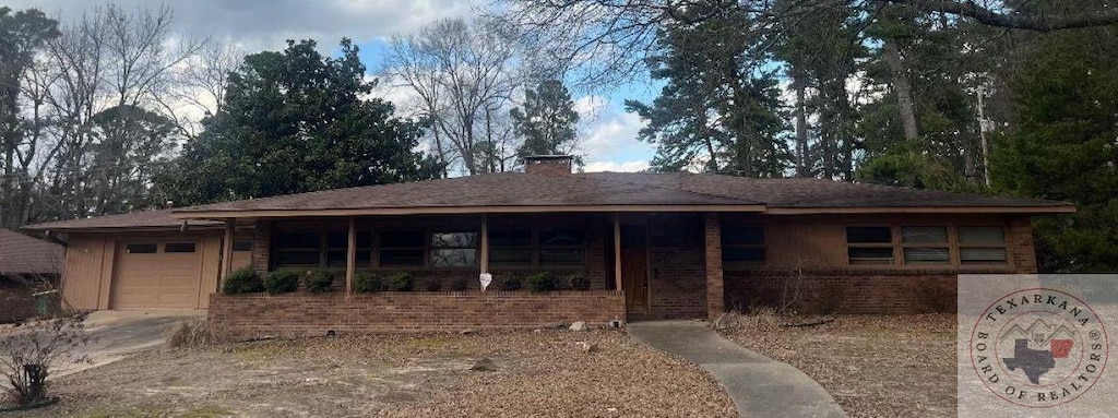 ranch-style house featuring a garage