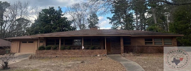 ranch-style house featuring a garage