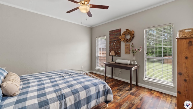bedroom featuring crown molding, baseboards, ceiling fan, and wood finished floors