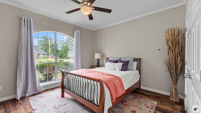 bedroom with baseboards, ornamental molding, wood finished floors, and multiple windows