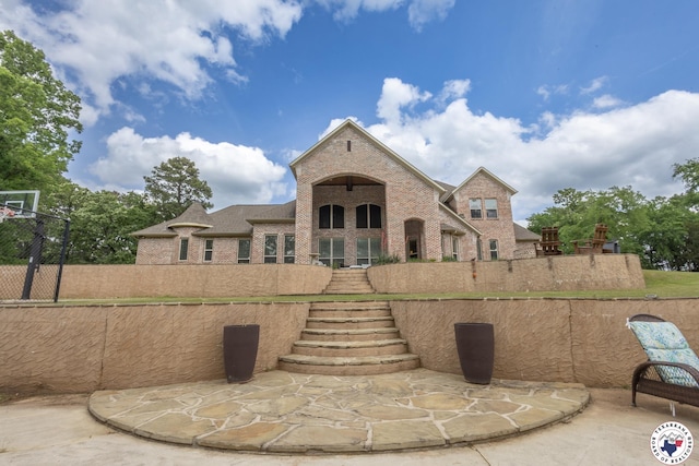 exterior space with stairs and brick siding
