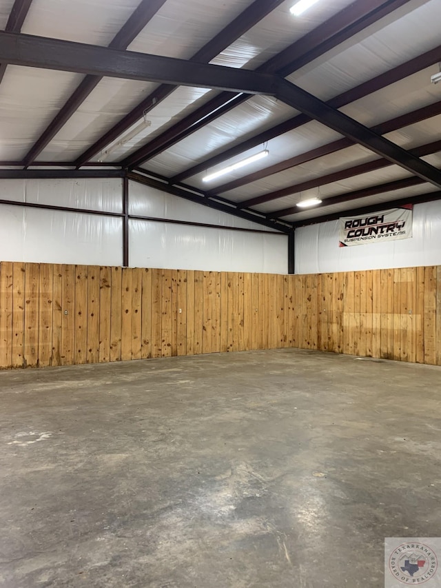 garage featuring wood walls