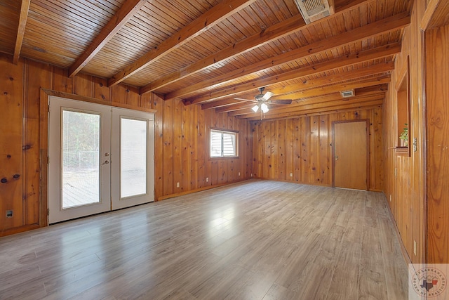 unfurnished room featuring wooden ceiling, light wood-type flooring, beamed ceiling, and french doors