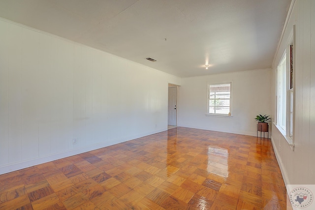 spare room with parquet floors