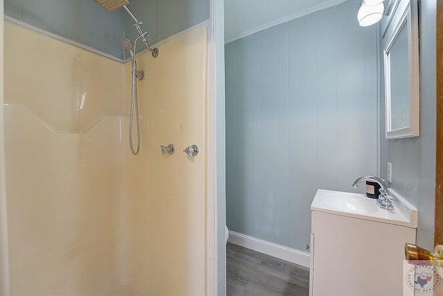 bathroom featuring a shower, wood-type flooring, and vanity