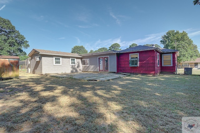 rear view of property featuring a yard