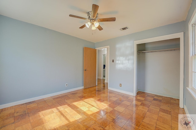 unfurnished bedroom with a closet and ceiling fan