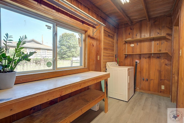 washroom with wood ceiling, light wood-type flooring, washer / dryer, and wooden walls