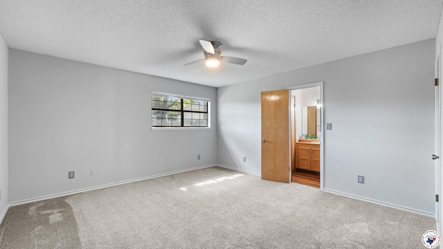 4707 Charleston St, Texarkana, AR 71854 - unfurnished bedroom with carpet, ensuite bathroom, a textured ceiling, and baseboards