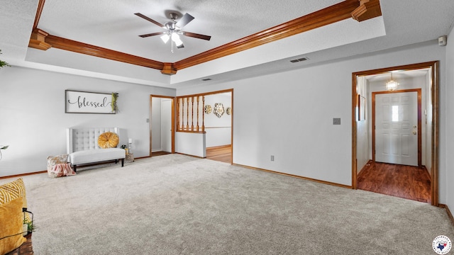 4707 Charleston St, Texarkana, AR 71854 - unfurnished room featuring a tray ceiling, carpet, crown molding, ceiling fan, and baseboards