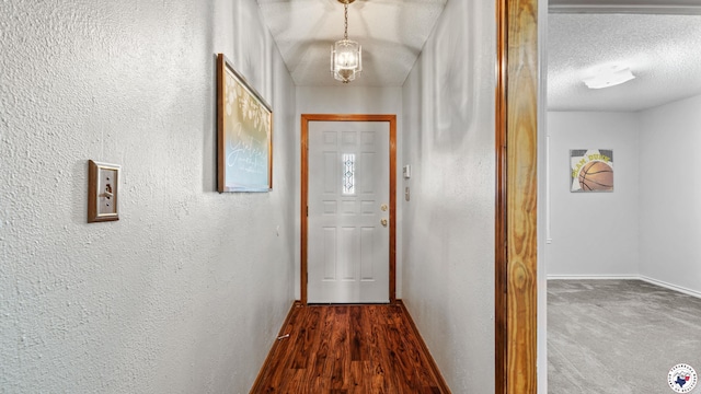 4707 Charleston St, Texarkana, AR 71854 - hall featuring a textured wall, baseboards, and a textured ceiling