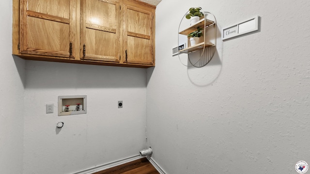 4707 Charleston St, Texarkana, AR 71854 - washroom with cabinet space, hookup for a washing machine, hookup for an electric dryer, baseboards, and dark wood finished floors