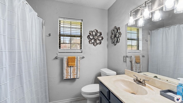 4707 Charleston St, Texarkana, AR 71854 - full bath with vanity, toilet, a textured ceiling, and curtained shower