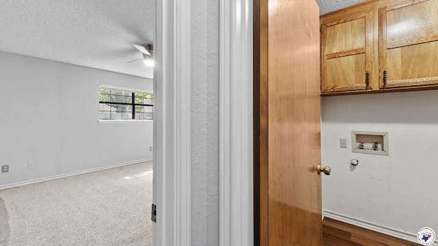 4707 Charleston St, Texarkana, AR 71854 - laundry area with cabinet space, hookup for a washing machine, a textured ceiling, carpet, and ceiling fan