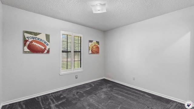 4707 Charleston St, Texarkana, AR 71854 - unfurnished room featuring a textured ceiling, dark colored carpet, and baseboards