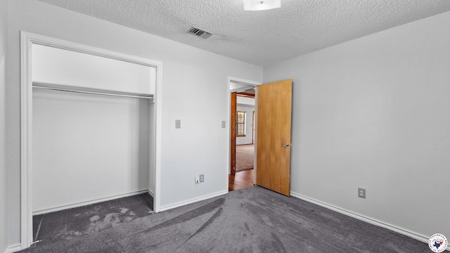 4707 Charleston St, Texarkana, AR 71854 - unfurnished bedroom featuring carpet, a textured ceiling, a closet, and baseboards