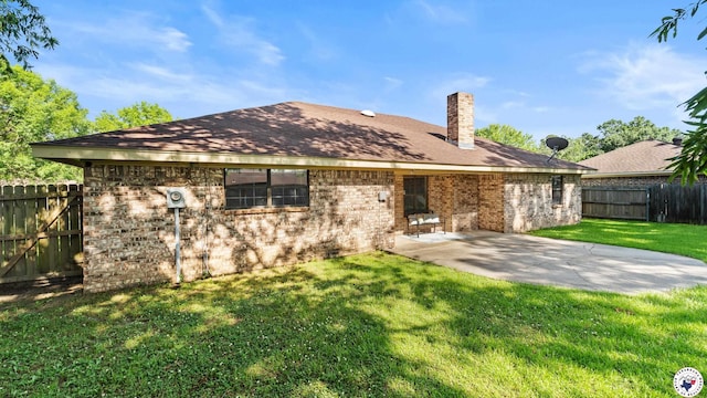4707 Charleston St, Texarkana, AR 71854 - rear view of property featuring a chimney, brick siding, and a patio area