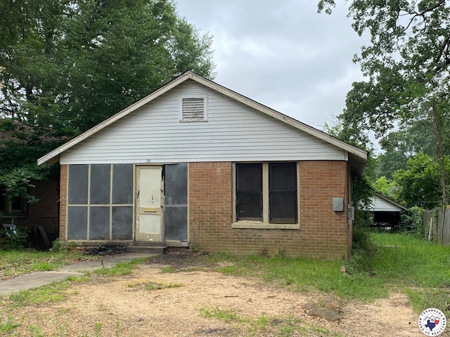 308 E 26th St, Texarkana, AR 71854 - view of front of property featuring brick siding and a sunroom